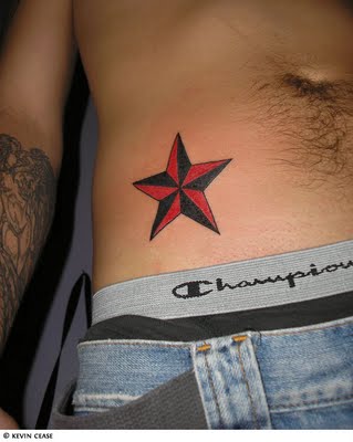 Black And Red Nautical Star Tattoo On Right Hip