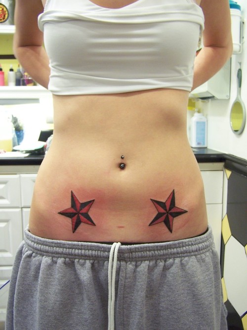 Black And Red Nautical Star Tattoos On Girl Stomach