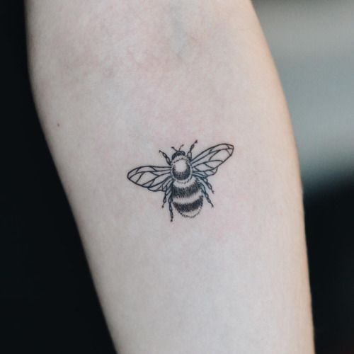 Black And White Bumblebee Tattoo On Forearm