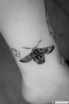 Black And White Bumblebee Tattoo On Left Ankle