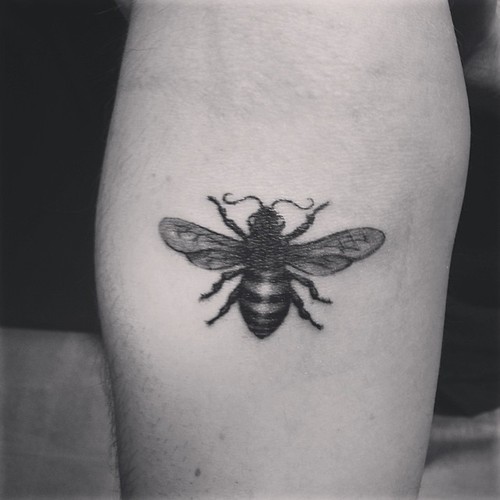 Black And White Bumblebee Tattoo On Left Forearm