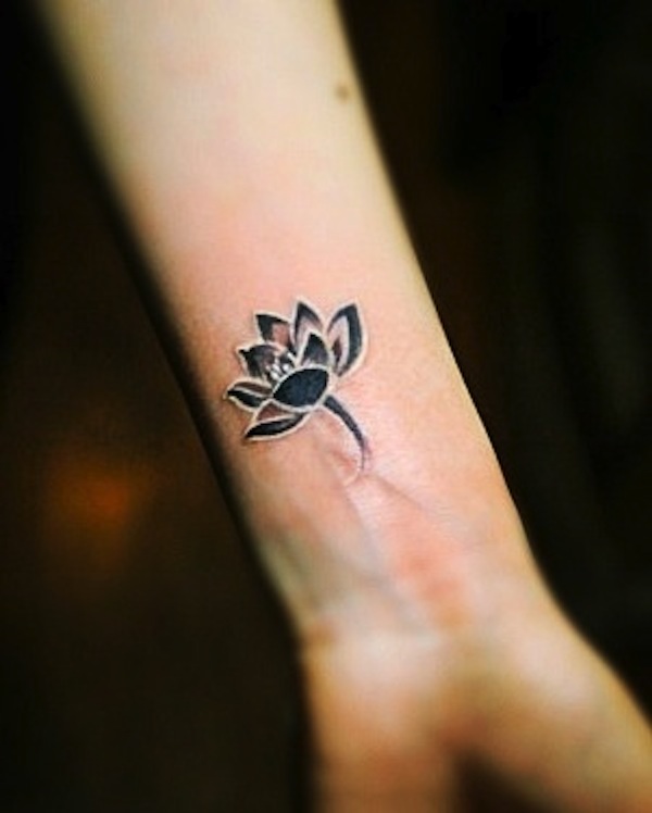 Black And White Lotus Flower Tattoo On Female Left Wrist