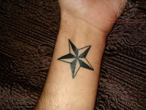 Black And White Nautical Star Tattoos On Left Wrist