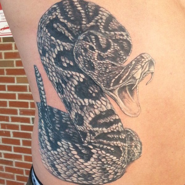 Black And White Rattlesnake Tattoo On Man Right Side Rib