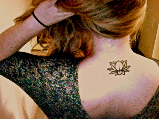 Black Henna Lotus Tattoo On Girl Back Neck