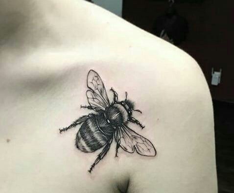 Black Ink Bumblebee Tattoo On Left Front Shoulder