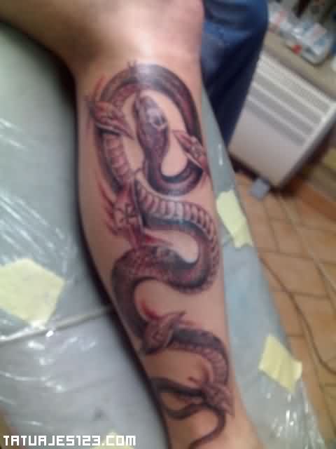 Black Ink Cobra Snake Tattoo On Right Leg