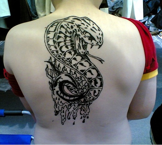 Black Ink Cobra Snake Tattoo On Upper Back
