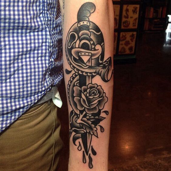 Black Ink Dagger With Snake And Rose Tattoo On Left Arm