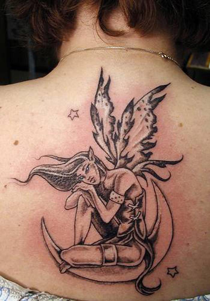 Black Ink Fairy On Half Moon Tattoo On Upper Back