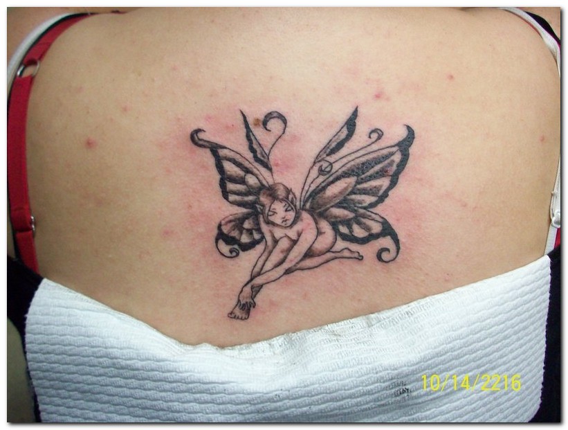 Black Ink Fairy Tattoo On Girl Upper Back
