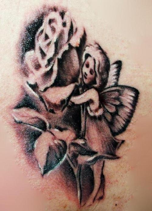 Black Ink Fairy With Flower Tattoo Design