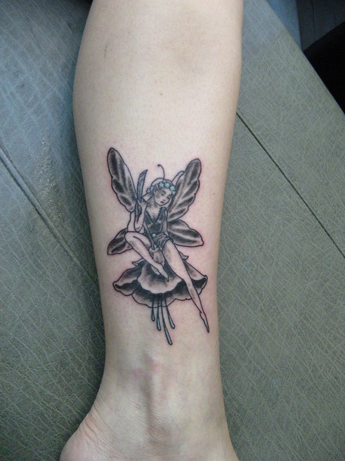 Black Ink Fairy With Flower Tattoo On Leg