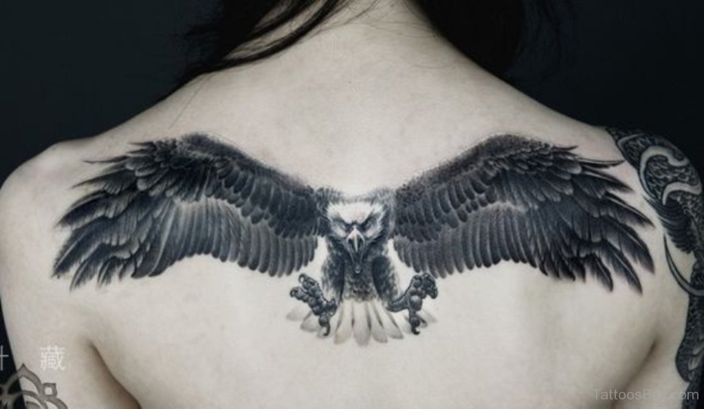 Black Ink Flying Eagle Tattoo On Girl Upper Back
