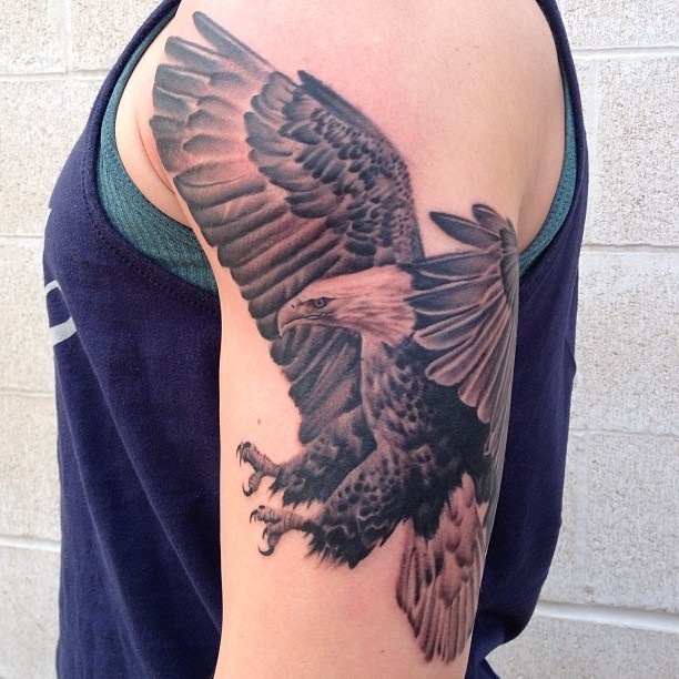 Black Ink Flying Eagle Tattoo On Left Half Sleeve