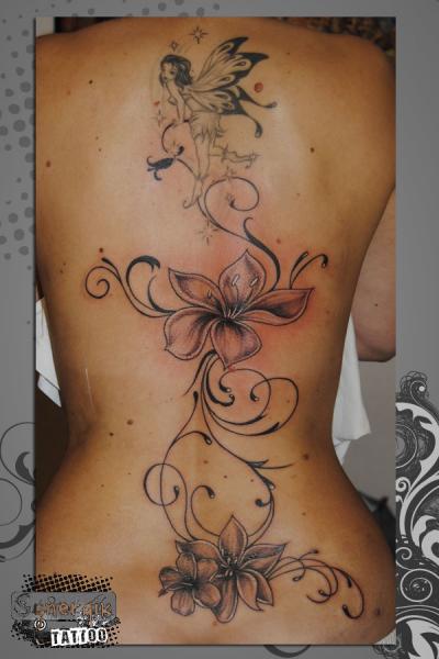 Black Ink Flying Fairy With Flowers Tattoo On Full Back