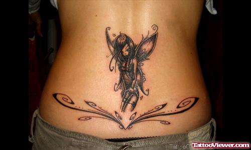Black Ink Gothic Fairy Tattoo On Girl Lower Back