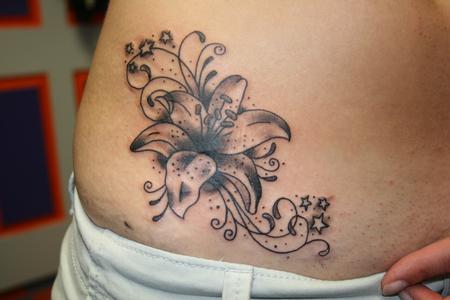Black Ink Lily Cover Up Tattoo On Right Waist