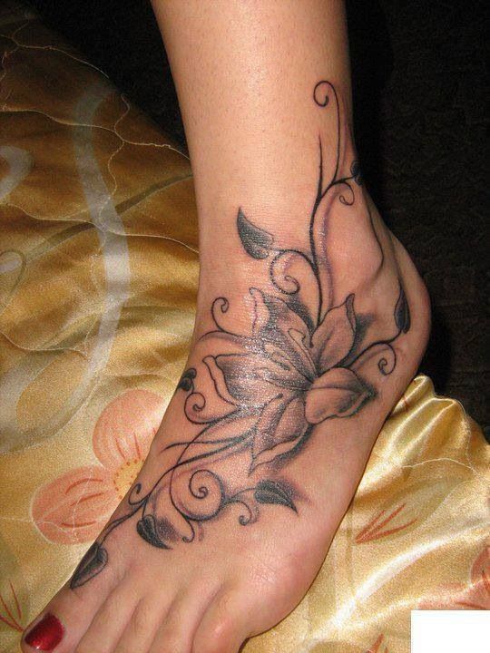 Black Ink Lily Flower Tattoo On Girl Left Foot