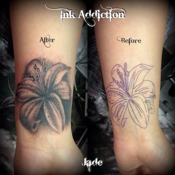 Black Ink Lily Flower Tattoo On Wrist