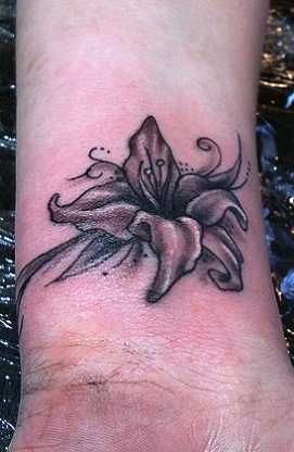Black Ink Lily Flowers Tattoo Design For Wrist