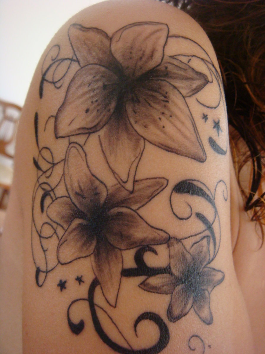 Black Ink Lily Flowers Tattoo On Girl Right Upper Arm