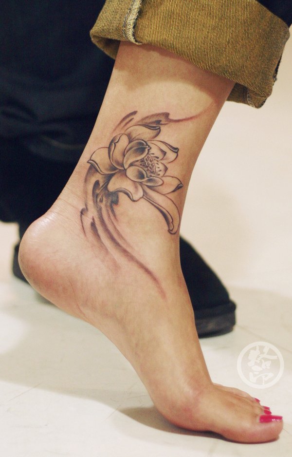 Black Ink Lotus Flower Tattoo On Female Left Foot Ankle