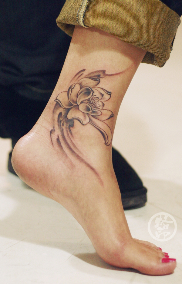Black Ink Lotus Flower Tattoo On Girl Left Foot Ankle