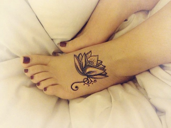 Black Ink Lotus Flower Tattoo On Girl Left Foot