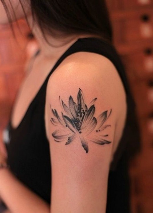 Black Ink Lotus Flower Tattoo On Girl Left Upper Arm
