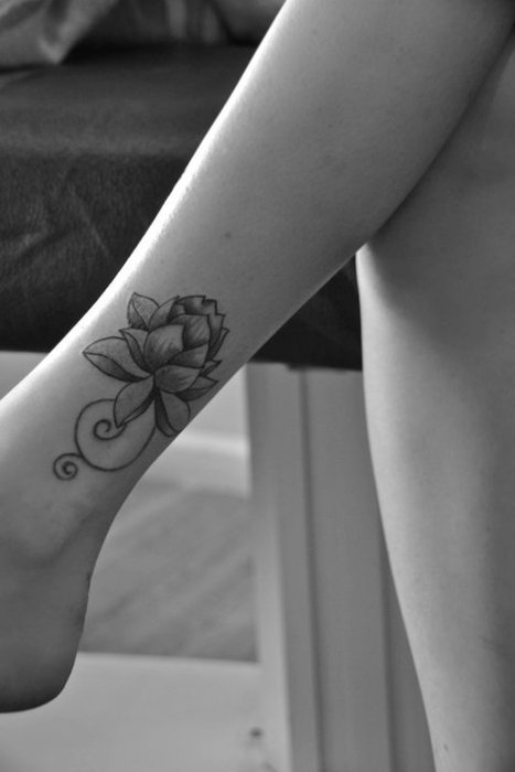 Black Ink Lotus Flower Tattoo On Left Ankle