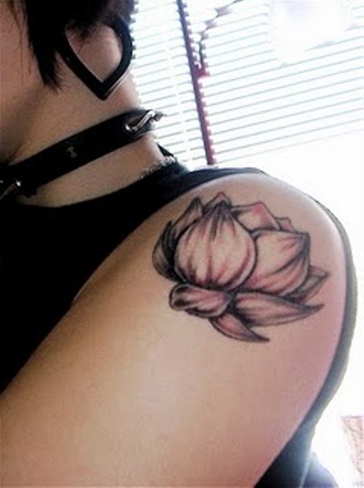 Black Ink Lotus Flower Tattoo On Left Shoulder