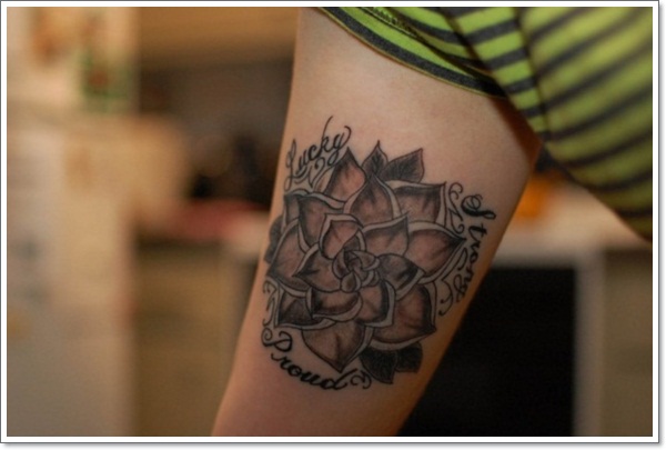 Black Ink Lotus Flower Tattoo On Man Bicep