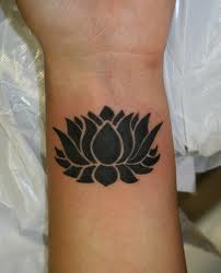 Black Ink Lotus Flower Tattoo On Wrist