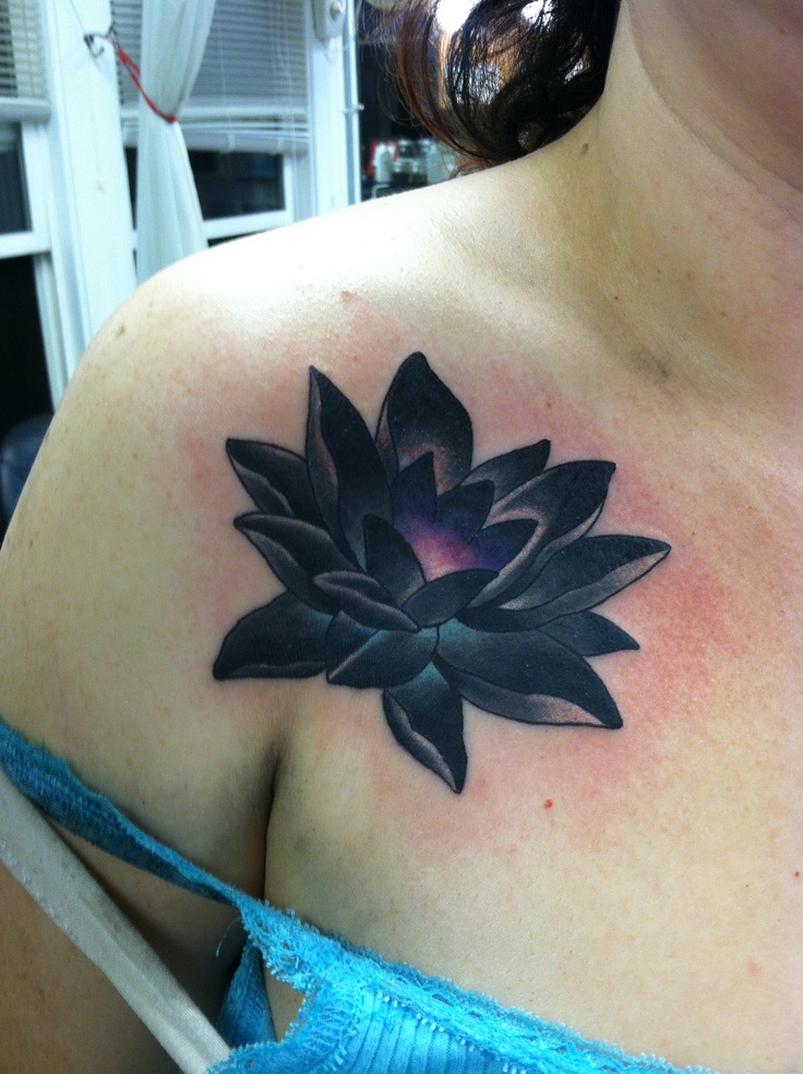 Black Ink Lotus Tattoo On Girl Right Front Shoulder