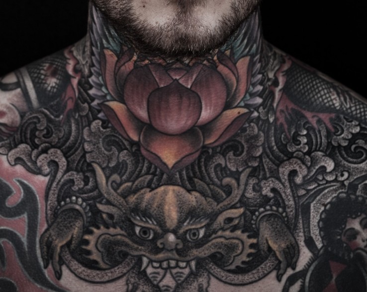 Black Ink Lotus Tattoo On Man Neck by Thomas Hooper