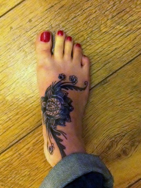 Black Ink Mandala Flower Tattoo On Girl Right Foot