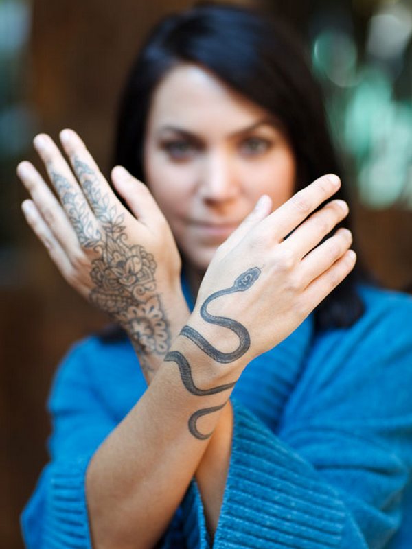 Black Ink Rattlesnake Tattoo On Girl Left Wrist