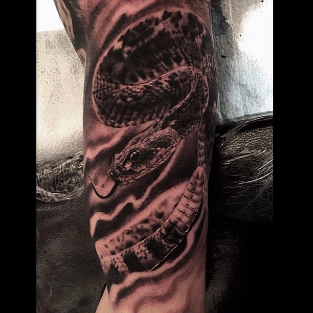 Black Ink Rattlesnake Tattoo On Half Sleeve