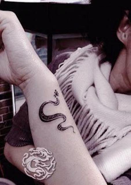 Black Ink Rattlesnake Tattoo On Left Wrist