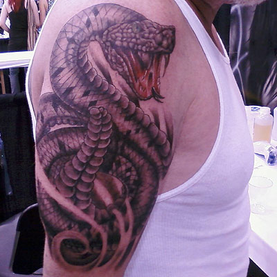 Black Ink Rattlesnake Tattoo On Man Right Half Sleeve