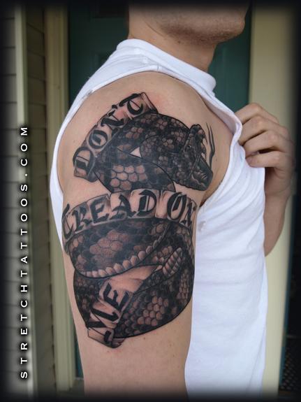 Black Ink Rattlesnake With Banner Tattoo On Man Right Half Sleeve