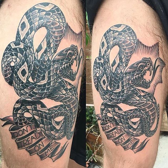 Black Ink Rattlesnake With Banner Tattoo On Thigh