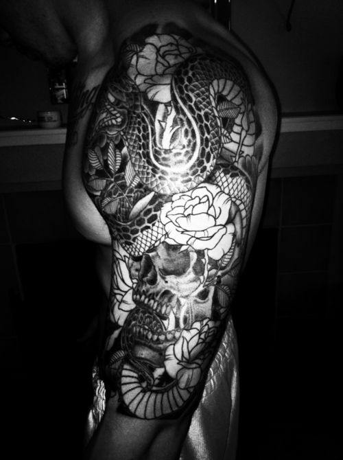 Black Ink Skull With Snake Tattoo On Man Left Half Sleee