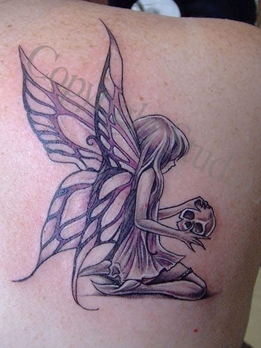 Black Ink Small Fairy With Skull Tattoo On Right Back Shoulder