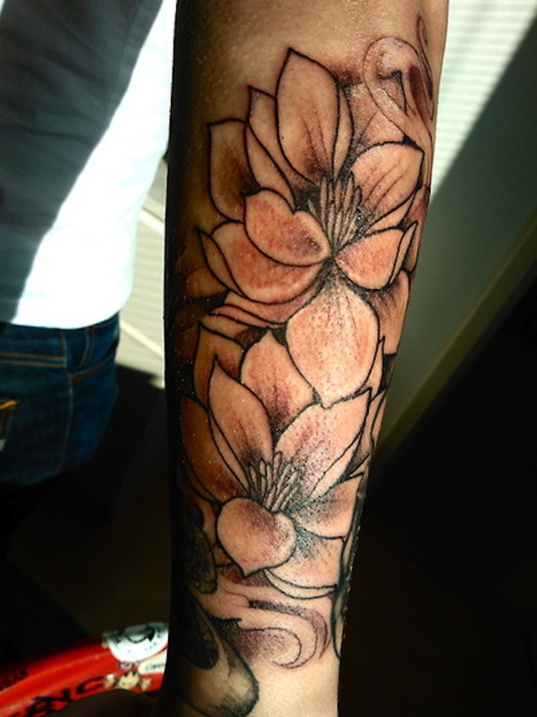 Black Ink Small Lotus Flowers Tattoo Design For Sleeve