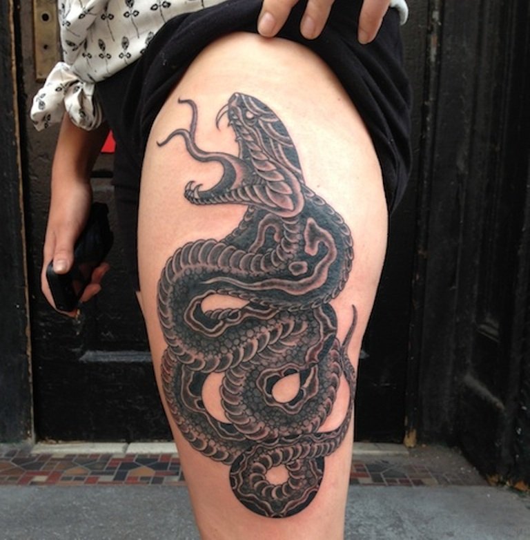 Black Ink Snake Tattoo On Girl Left Thigh