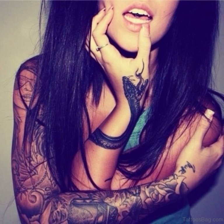 Black Ink Snake Tattoo On Girl Left Wrist