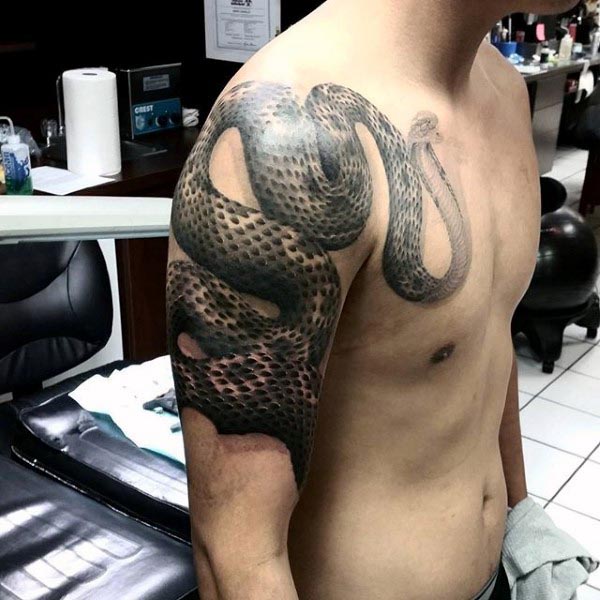 Black Ink Snake Tattoo On Man Right Wrapped Around Upper Arm