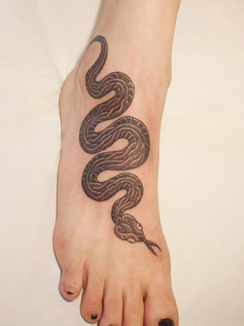 Black Ink Snake Tattoo On Women Right Foot